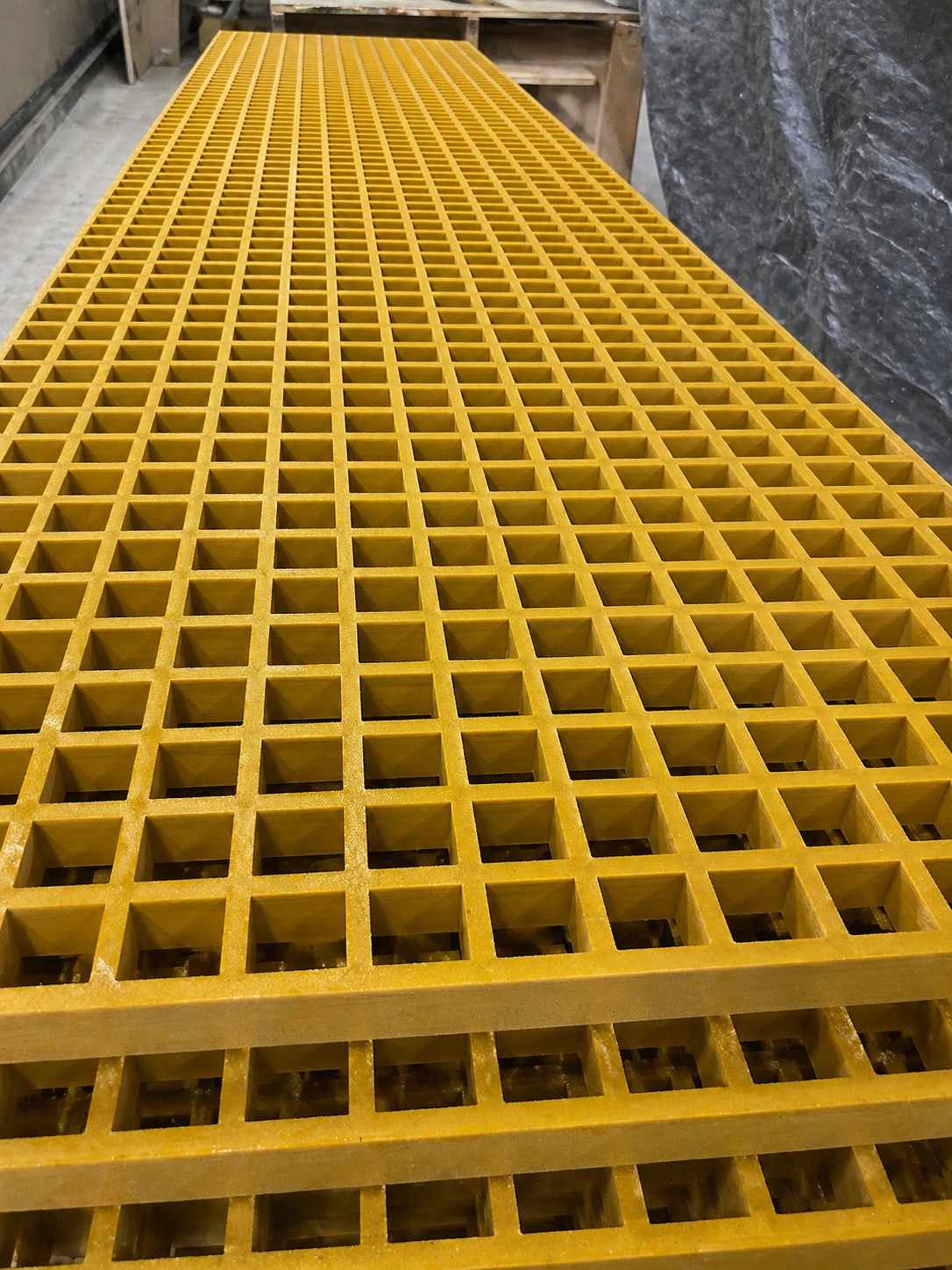 Yellow FRP molded grating panel close-up